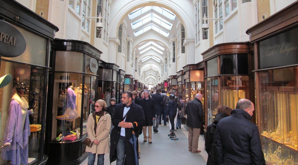 Shopping Centre - outside of shops with people walking around.