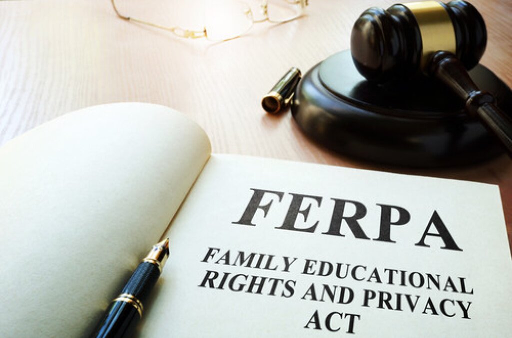 A gavel, pen and book with FERPA written on it.