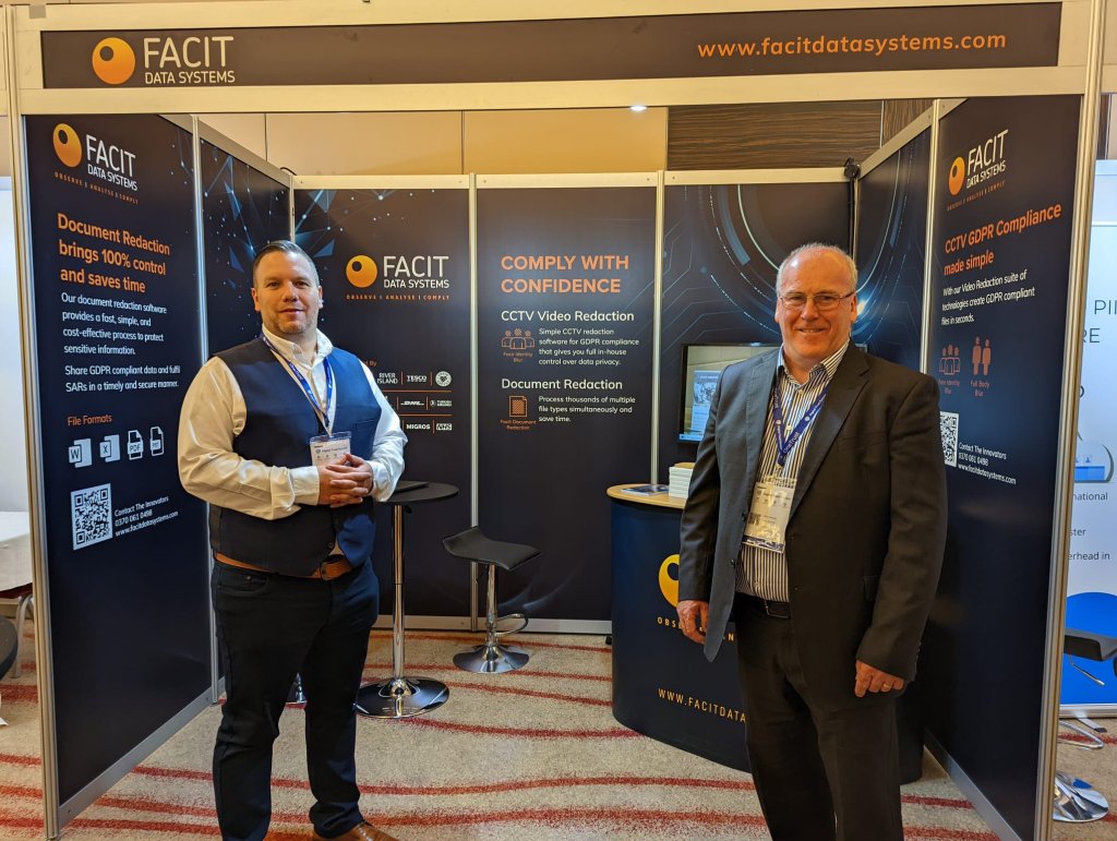 Facit stand and staff at an event.