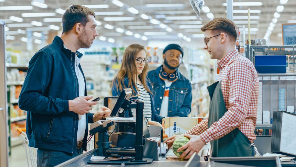 Customer buying goods at a checkout.