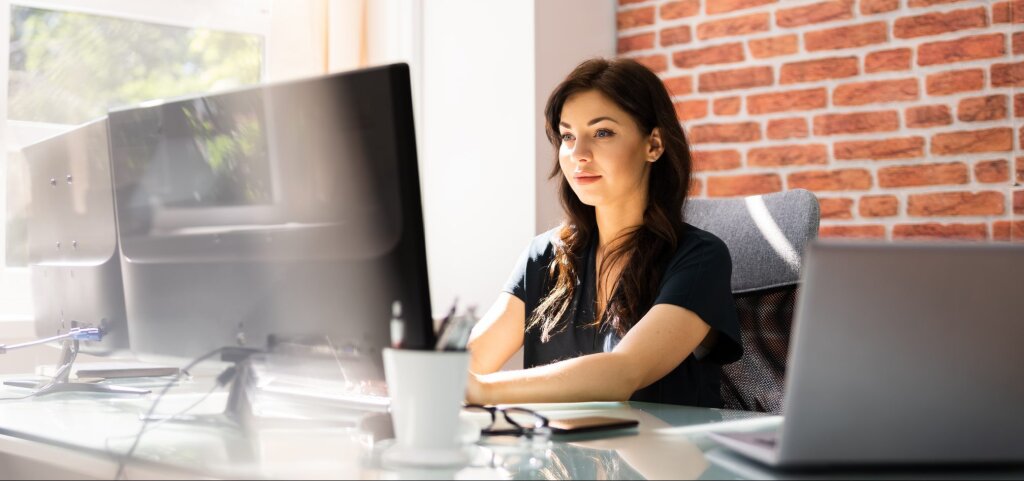 Woman working at a computer.